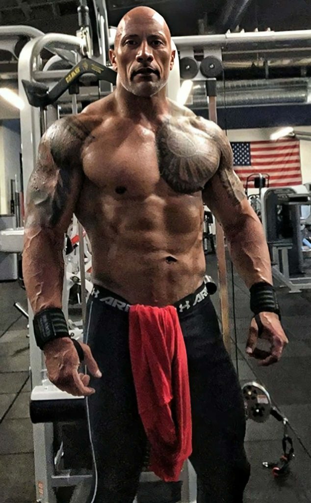 Dwayne Johnson intense gym workout in Under Armour with American flag motivational fitness wallpaper