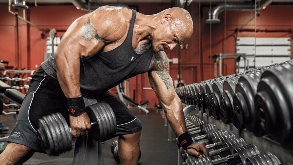 Motivational Dwayne Johnson Intense Dumbbell Workout Wallpaper
