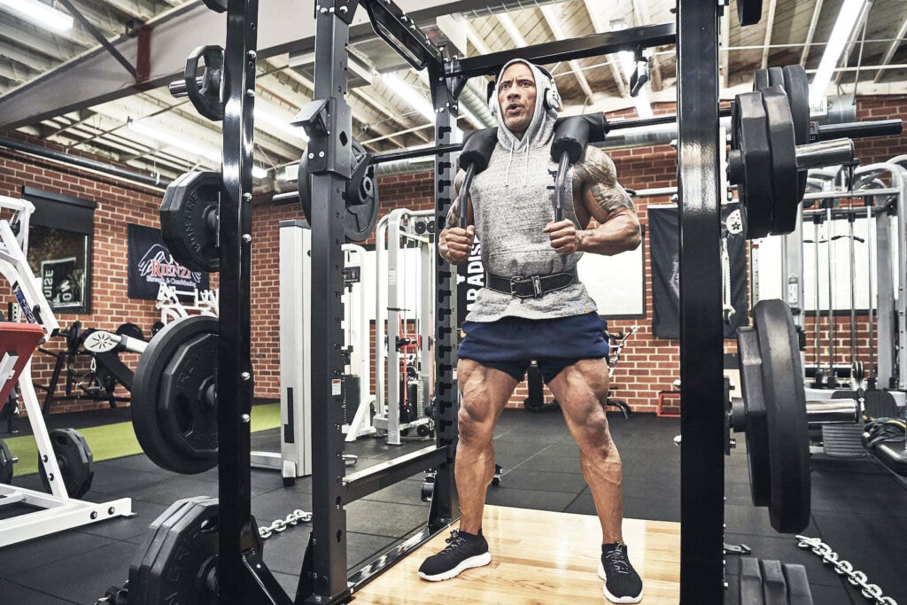 Dwayne Johnson in Gray Project Rock Hoodie: Intense Gym Workout Wallpaper
