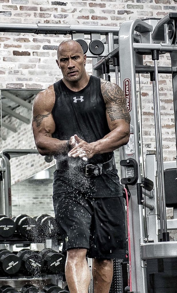 Dwayne The Rock Johnson chalk dust gym wallpaper muscular physique brick wall iPhone background