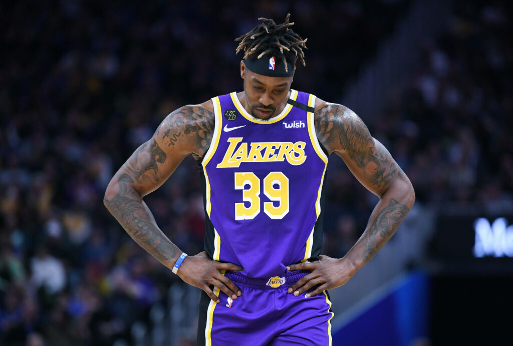 Dwight Howard in Lakers jersey 39 showing determination on court during energetic NBA game wallpaper