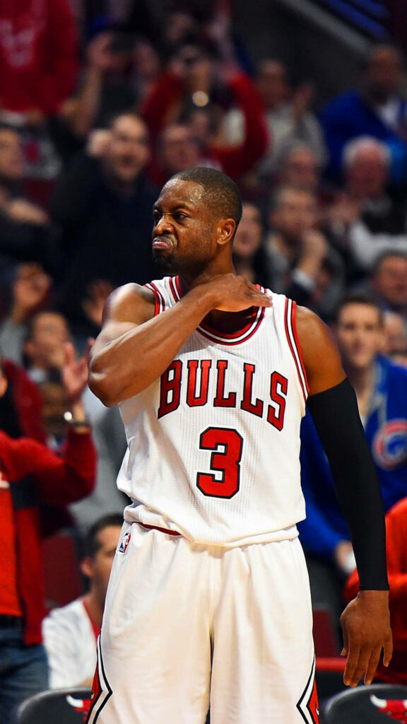 Dwyane Wade Chicago Bulls number 3 jersey mid-action fierce throat slash on basketball court Wallpaper