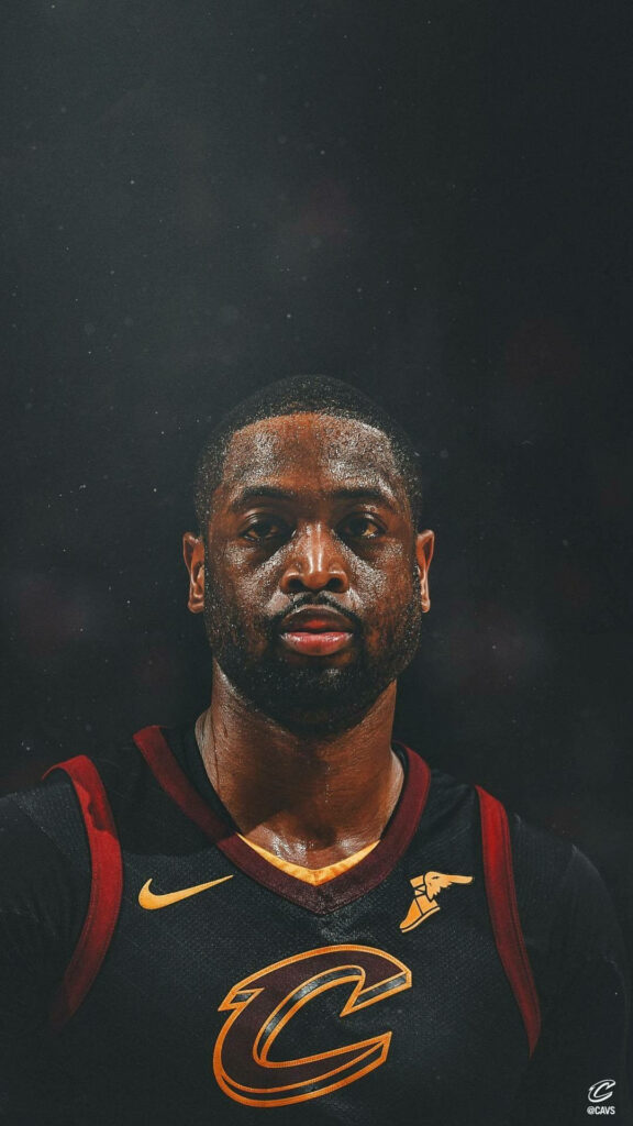Dwyane Wade in Cleveland Cavaliers jersey sweat glowing intense focused expression dark background Wallpaper
