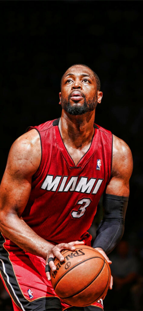 Dwyane Wade Miami Heat preparing three-point shot in red jersey dramatic basketball wallpaper