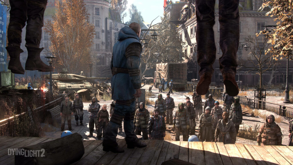 Dying Light 2 Execution wallpaper showing hanged bodies and survivors in a decayed city square