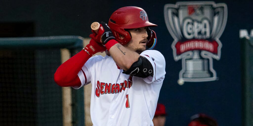 Dylan Crews focused at bat in white and red uniform with tournament logo background wallpaper
