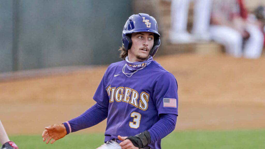 Dylan Crews in LSU baseball uniform number 3 showing focus and athleticism in game action Wallpaper