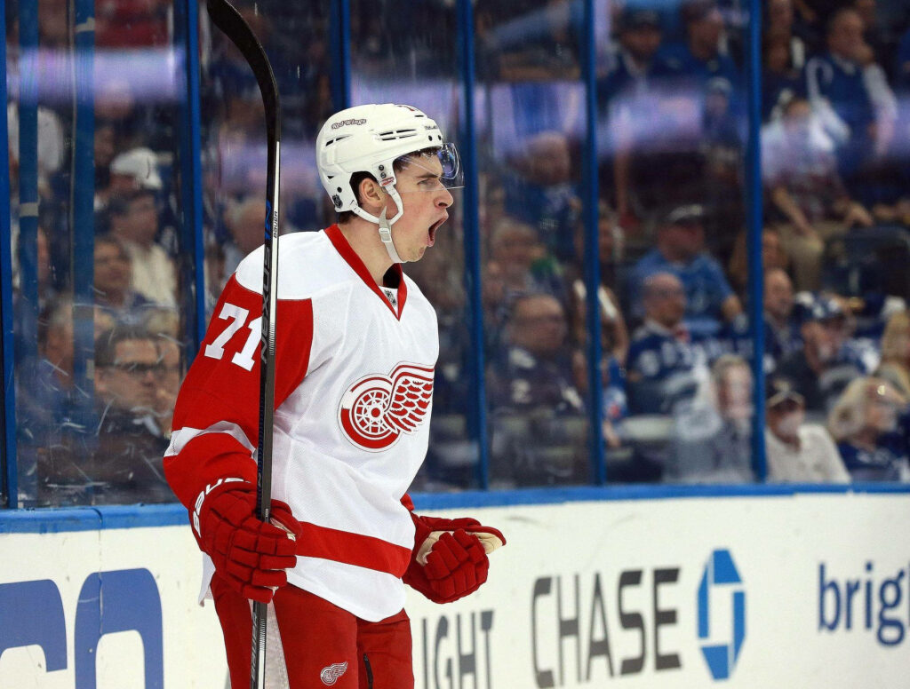 Dylan Larkin Detroit Red Wings captain in action wearing number 71 hockey jersey on ice Wallpaper