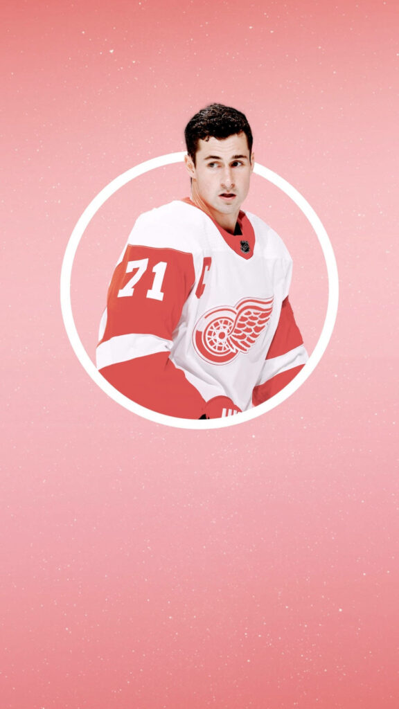 NHL captain Dylan Larkin Detroit Red Wings jersey portrait on pink gradient modern wallpaper background