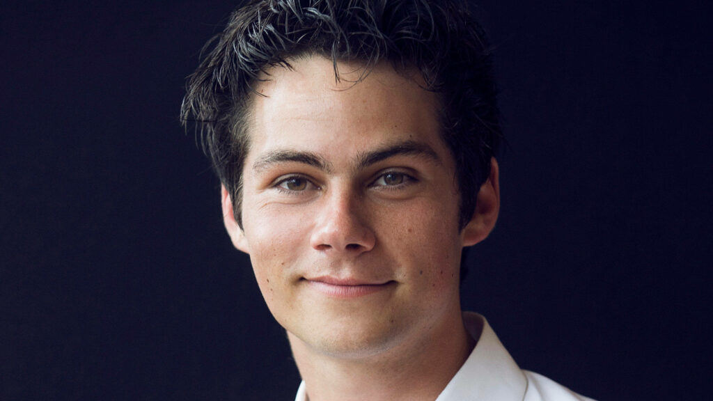Dylan O'Brien close-up portrait Vogue wallpaper with natural expression and classic editorial style