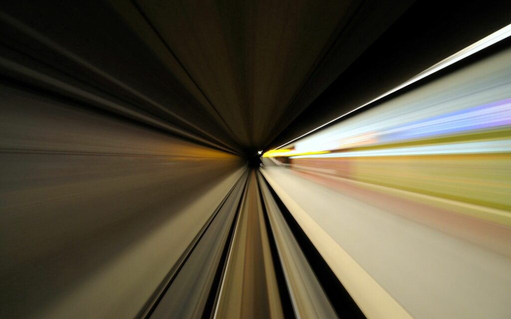 Futuristic Tunnel Wallpaper: Speed & Color Dynamic 1920x1200 Background