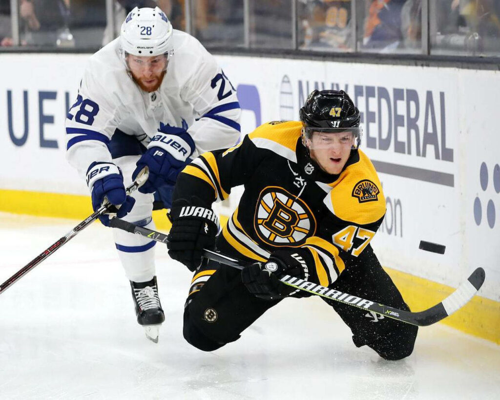 Torey Krug Bruins and Connor Brown Maple Leafs intense 2019 NHL on ice action wallpaper background