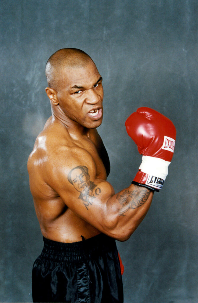 Epic 4K Mike Tyson Portrait: Intense Boxing Pose Wallpaper Background