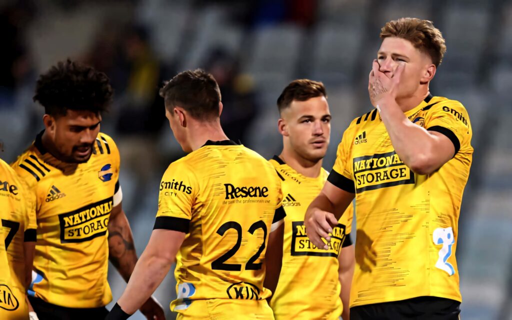 ACT Brumbies rugby players in yellow black jerseys intense action dynamic sports wallpaper background