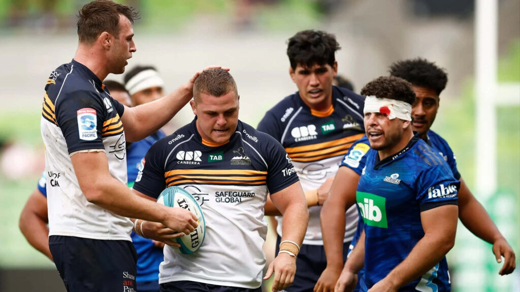 Dynamic ACT Brumbies rugby players in action displaying team spirit and athleticism wallpaper