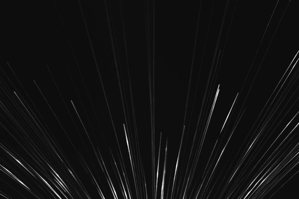 Dynamic Abstract Wallpaper: Glowing White Lines on Black Background