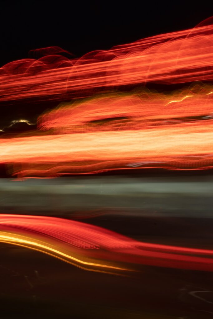 Vibrant Abstract Long-Exposure Wallpaper: Red & Orange Light Trails