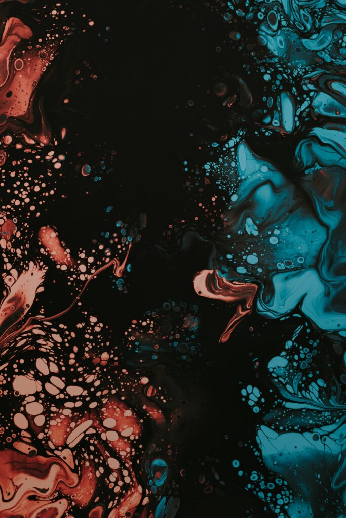 Dynamic Abstract Wallpaper: Vivid Blue & Red Paint on Black Background