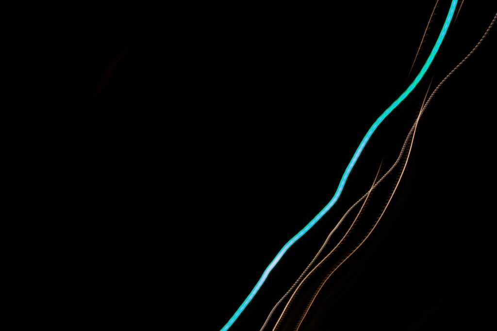 Abstract Light Lines Wallpaper - Dynamic Design on Dark Background