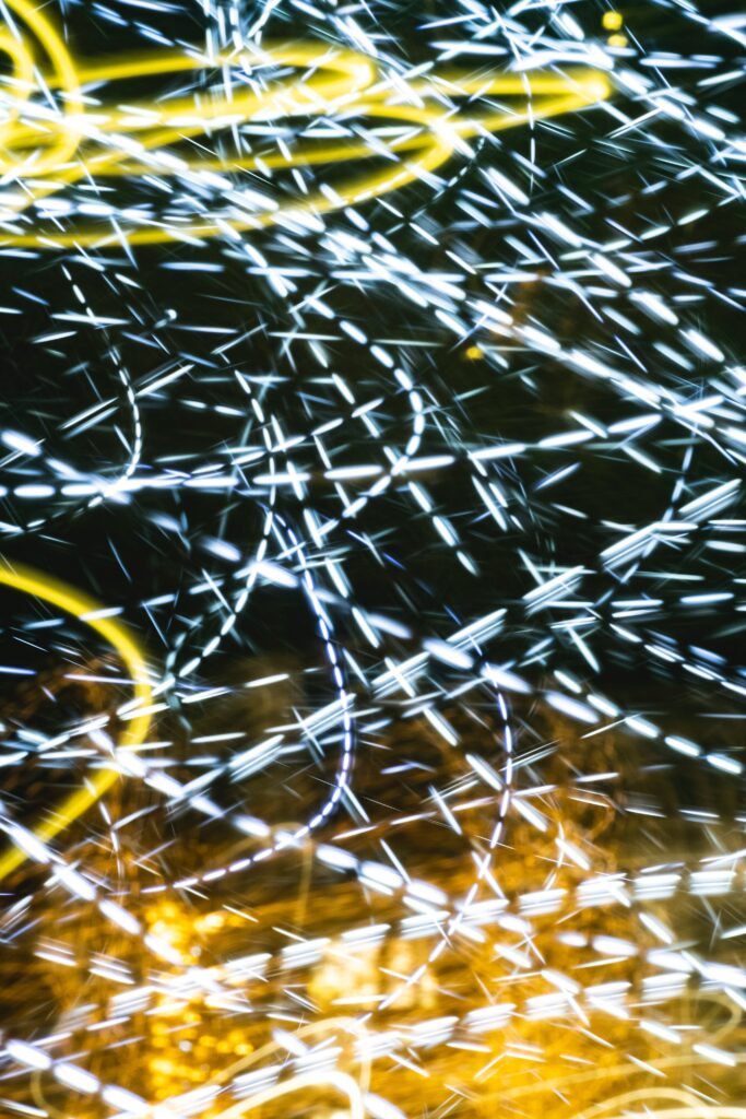 Dynamic Abstract Light Streaks Wallpaper: Bright Energy on Dark Background