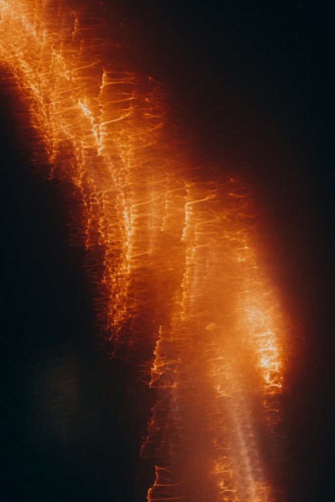 Dynamic Blurred Abstract Wallpaper with Warm Orange and Red Hues