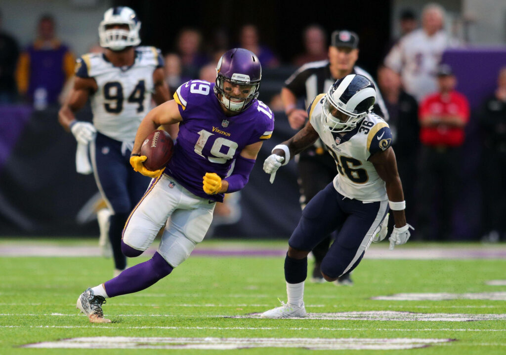 Adam Thielen Dynamic Football Wallpaper: Agility & Action Background
