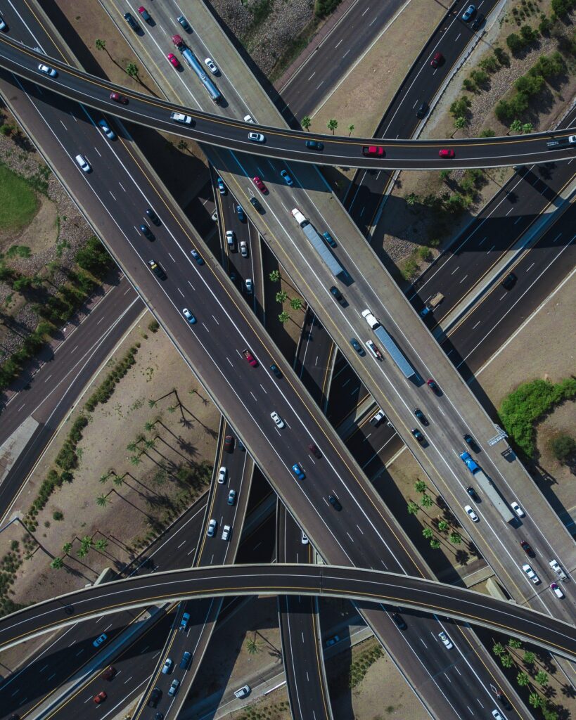 Aerial Highway Interchange Wallpaper: Urban Traffic Flow Background