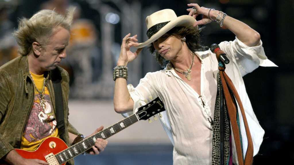 Dynamic Aerosmith Wallpaper: Joe Perry & Steven Tyler Live on Stage