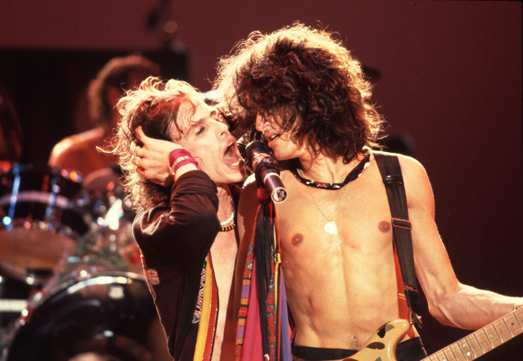 Dynamic Aerosmith Wallpaper: Tyler & Perry's Intense Live Performance
