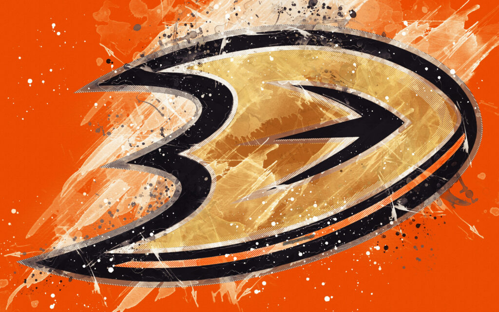 Dynamic paint art Anaheim Ducks logo on vibrant orange background hockey team wallpaper