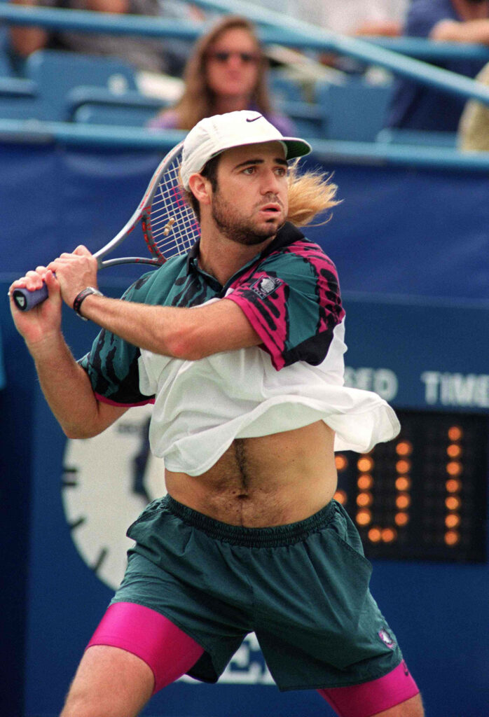 Dynamic Wallpaper: Andre Agassi in Action - Intense Tennis Focus
