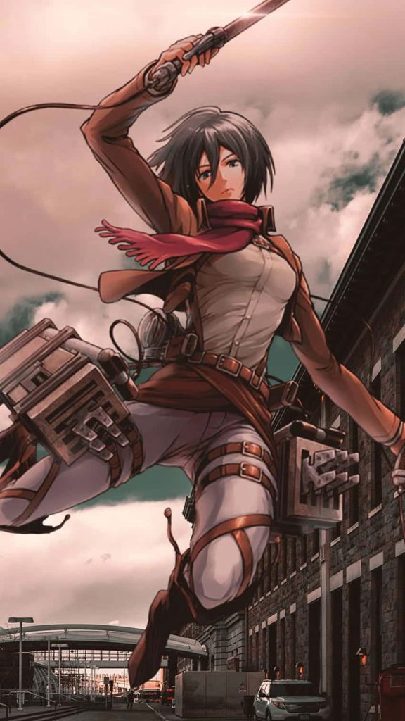 Attack on Titan Mikasa Ackerman mid-air action pose in Scout Regiment gear with urban backdrop Wallpaper