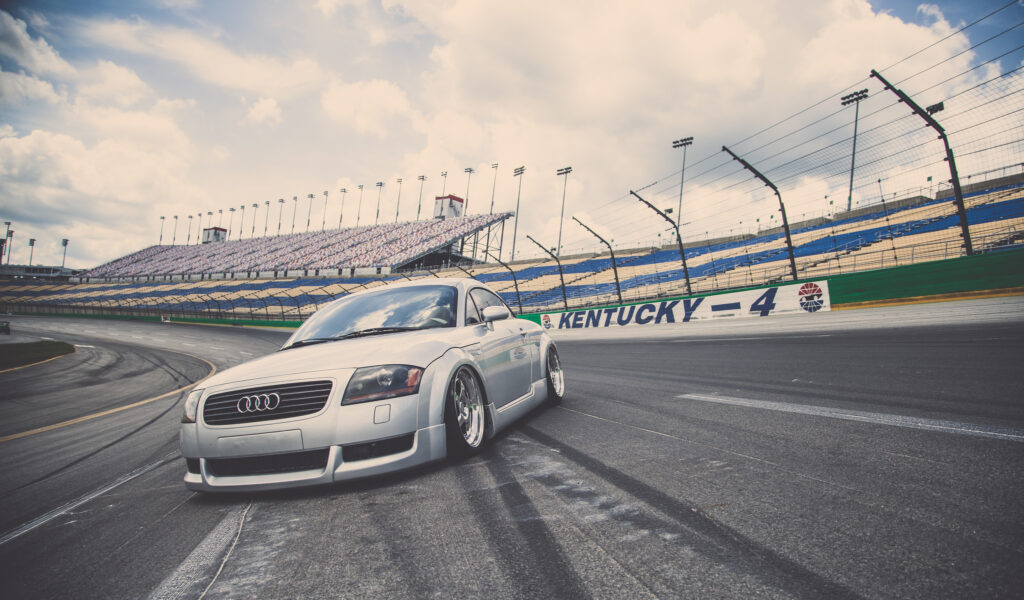 Silver Audi TT Sports Car Wallpaper on Racetrack - Dynamic View