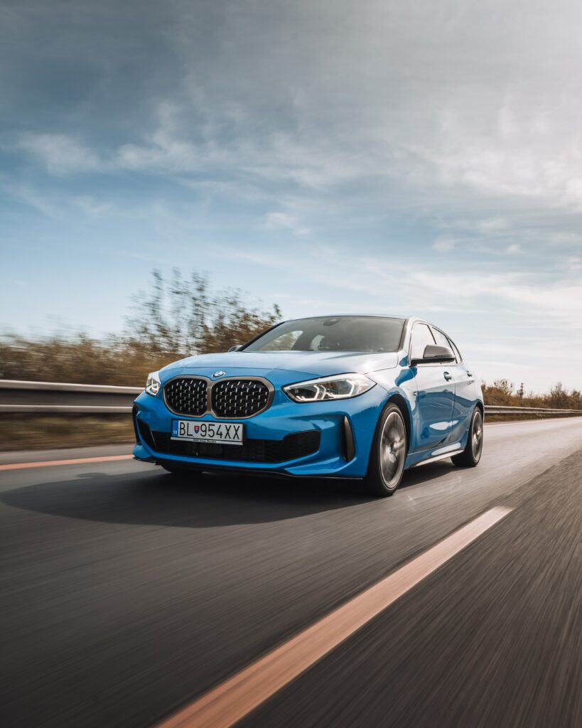 Sleek BMW Car in Motion: Speed & Elegance on the Highway Wallpaper