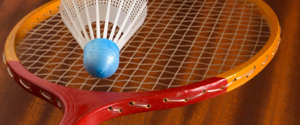 Badminton and Shuttlecock on Wooden Floor Background Wallpaper
