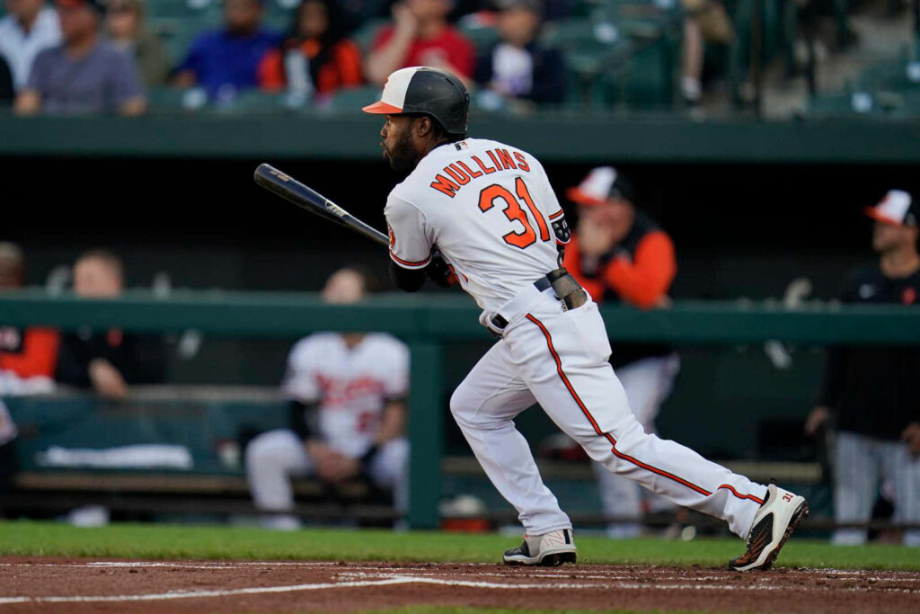 Baseball player mid-swing action on field showcasing energy and excitement of pro baseball Wallpaper