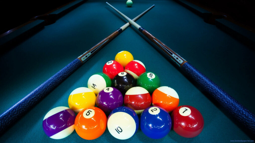 Dynamic Billiard Scene Wallpaper: Colorful Balls & Crossed Cues