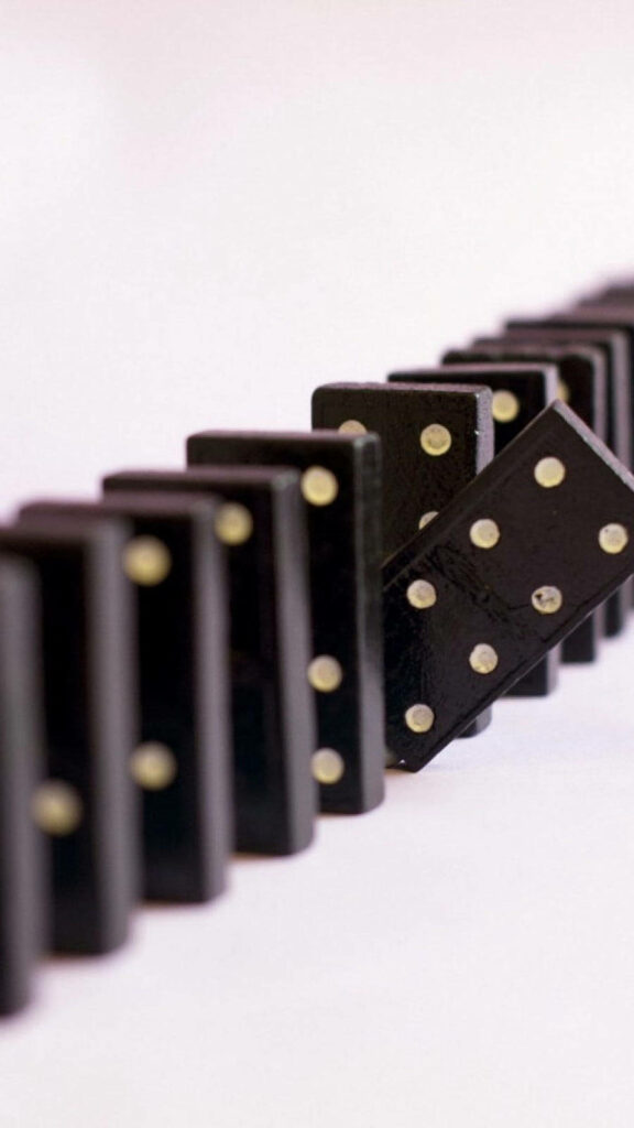 Dynamic Black Dominoes Wallpaper: Anticipation in Motion