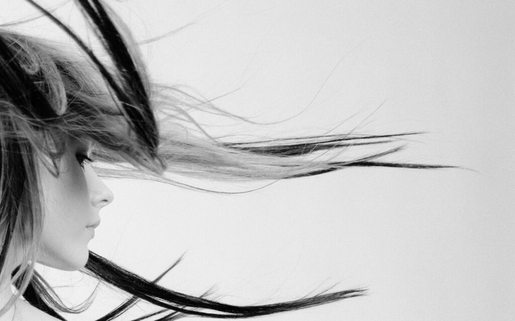 Dynamic Black and White Hair Wallpaper: Movement & Minimalism