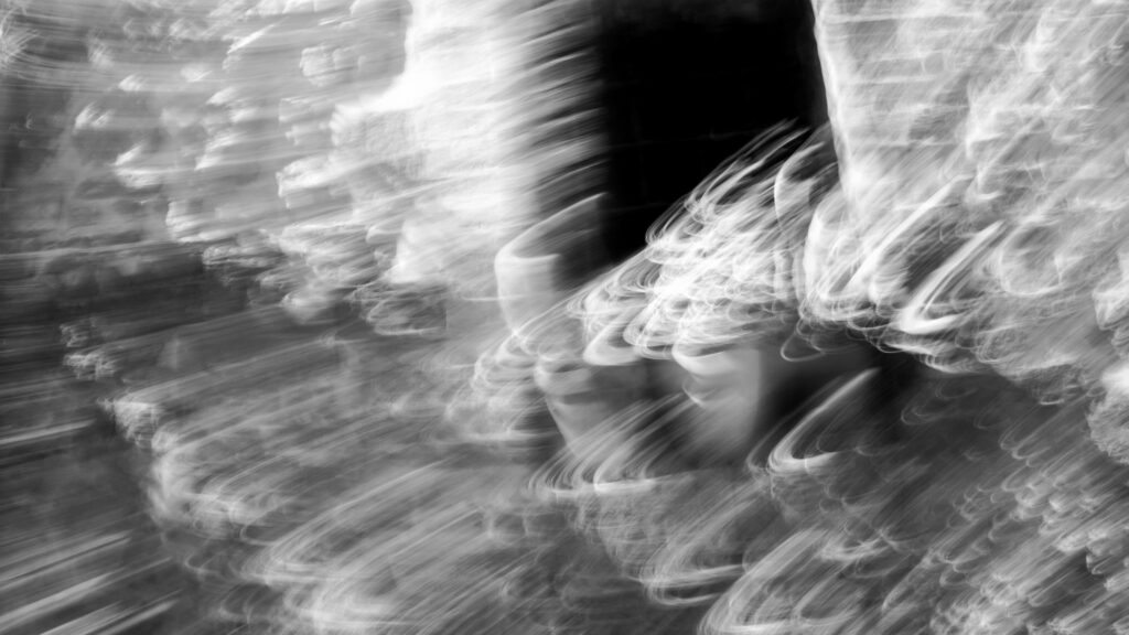 Dynamic Black & White Abstract Wallpaper with Ethereal Light Streaks