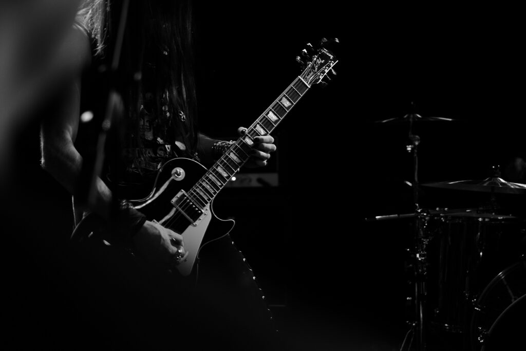 Passionate Guitarist Performance: Black and White Wallpaper Art