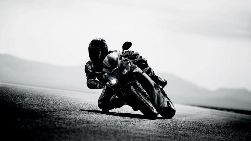 Dynamic Black and White Motorcycle Wallpaper - Speed and Adventure