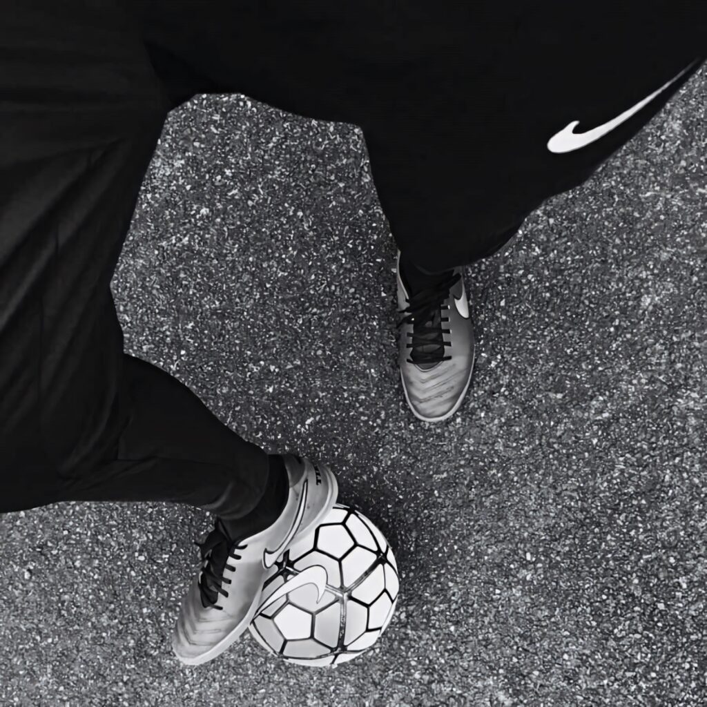 Dynamic Black and White Soccer Wallpaper: Player in Motion