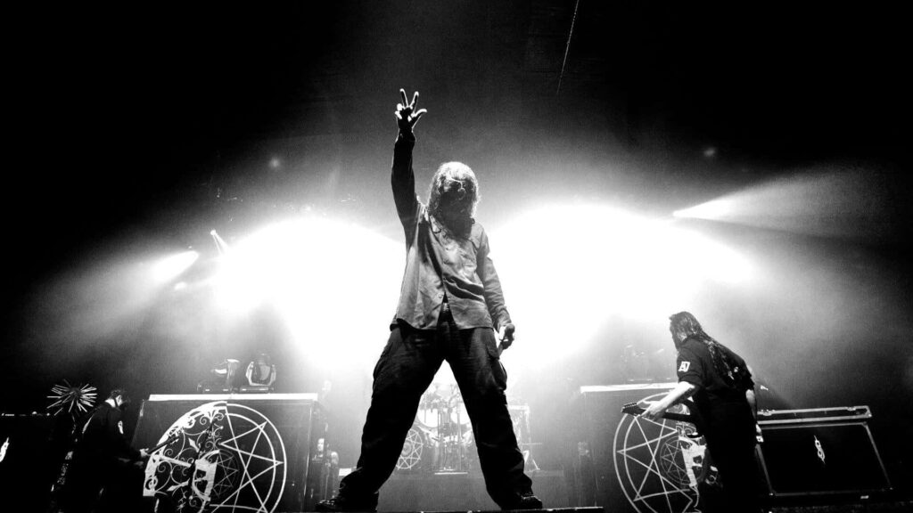 Dramatic Black and White Wallpaper: Man on Stage, Energetic Atmosphere