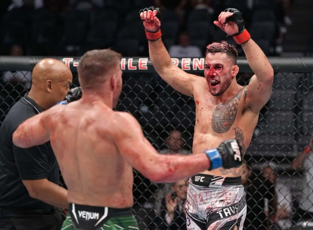 Brad Tavares intense UFC victory celebration blood sweat athletic physique octagon fight wallpaper