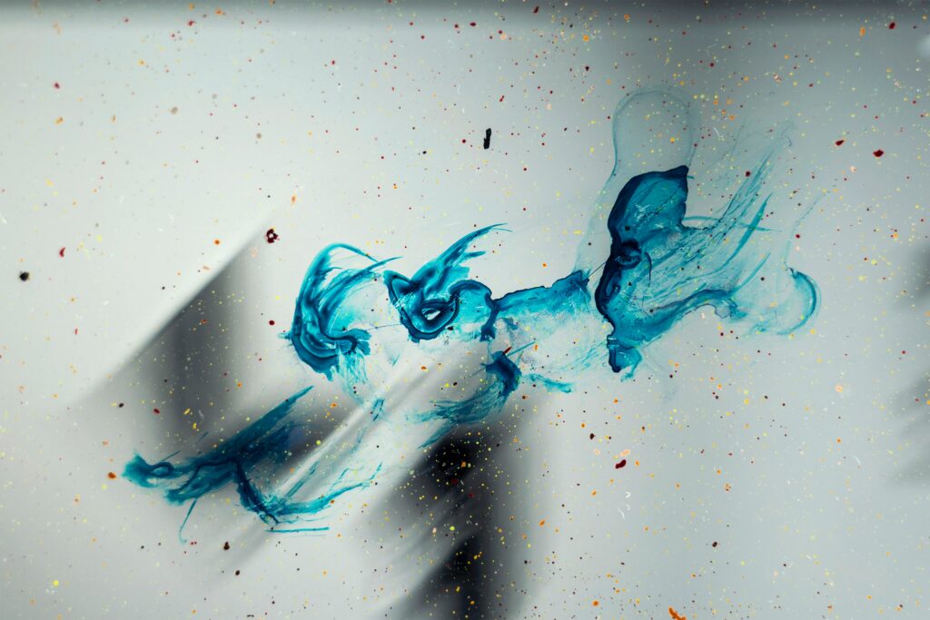 Dynamic Blue Abstract Wallpaper with Colorful Paint Splashes