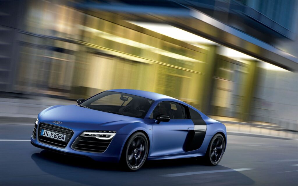 Stylish Blue Audi R8 V10 in Urban Setting – Dynamic Side View Wallpaper