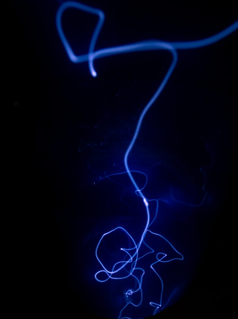 Dynamic Blue Neon Lines Wallpaper: Striking Dark Background Effect