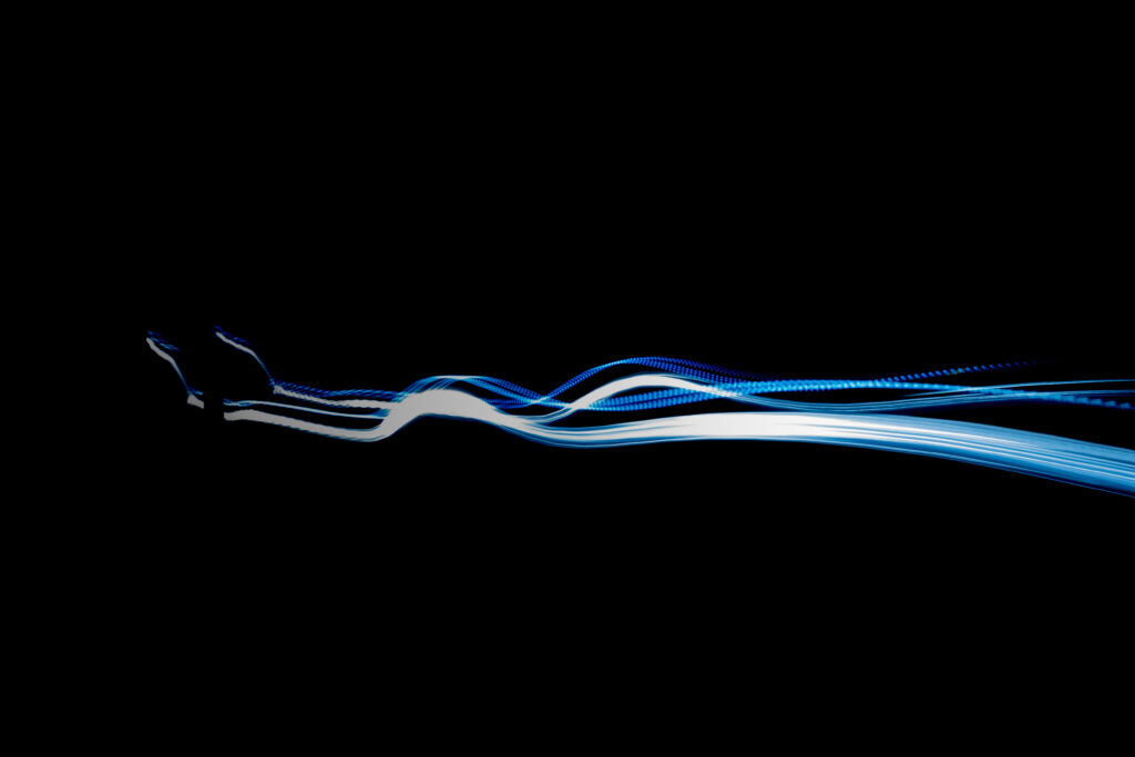 Sleek Wavy Blue & White Stripes Wallpaper on Black Background