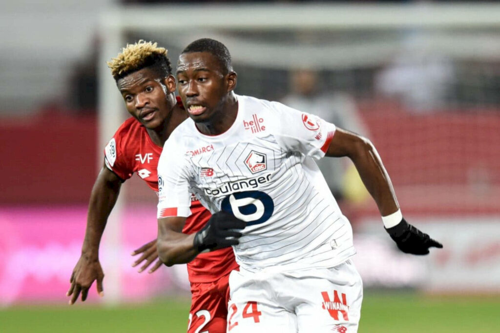 Boubakary Soumaré dynamic football action vibrant jerseys stadium background intense gameplay Wallpaper